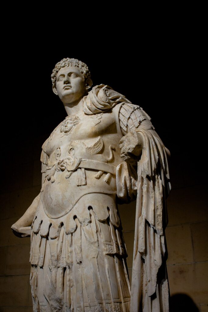 An ancient Roman sculpture titled "Portrait of a Young Man in Armor" on display in the Toledo Museum of Art. The sculpture originated from Aphrodisias in present-day Turkey.
